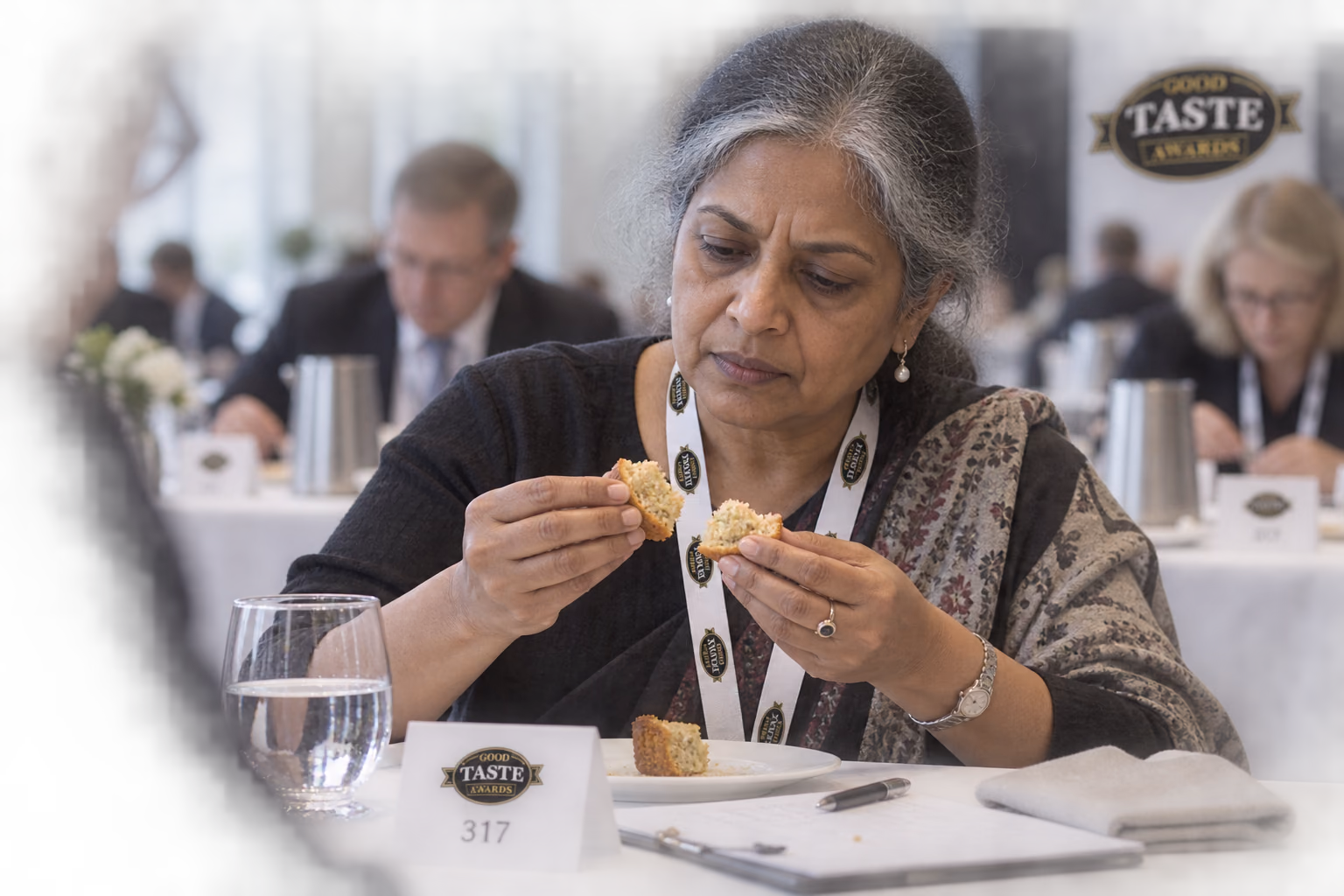 An assessor examining a food product during tasting